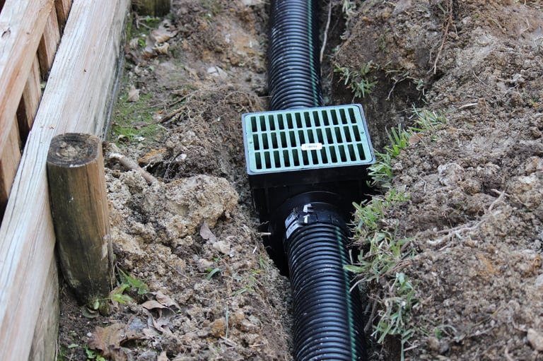 Drains ditch with rain drains sewage pipe